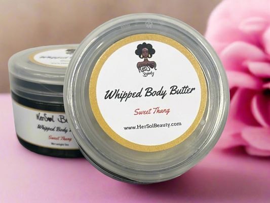 Whipped body butter container with a visible brand label